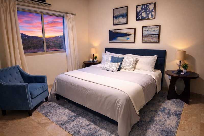 Desert-themed king bedroom at Casa de Corona, a Cabo San Lucas vacation rental