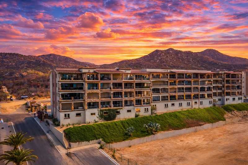 Casa de Corona condo building at sunset in El Tezal, Cabo San Lucas